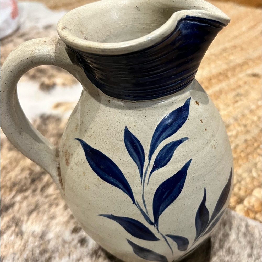Handcrafted Pottery Pitcher with Blue Leaf Design